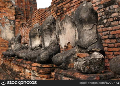 Buddhas near wall in wat Chai Wattanaram, Ayuthaya, Thailand