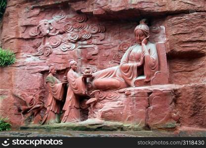 Buddhist goddes near the wall of rock in Emei SDhan, China