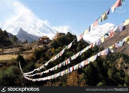 Buddhist monastery and flags near Manaslu in Nepal