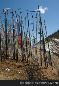 Buddhist prayer flags high in the Himalayan Mountains in the Kingdom of Bhutan.