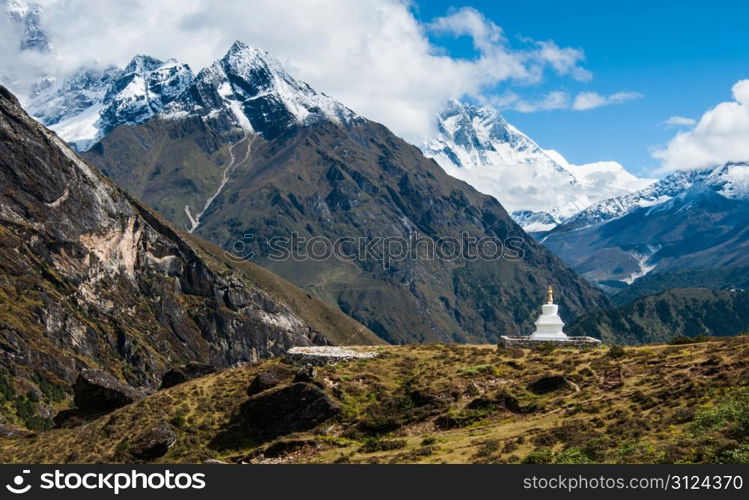 Buddhist stupe or chorten and Lhotse peaks in Himalayas. Religion in Nepal