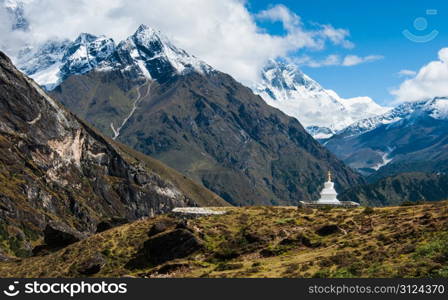 Buddhist stupe or chorten and Lhotse peaks in Himalayas. Religion in Nepal