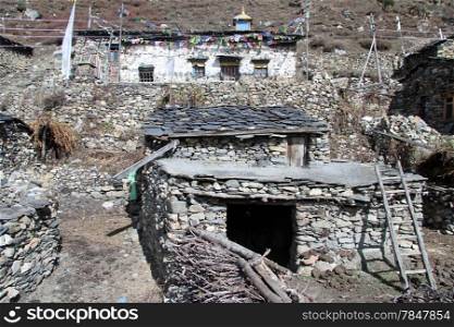 Buddhist temple and stone houses in village Samdo in Nepal