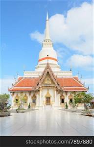 Buddhist temple with white pagoda in Thailand