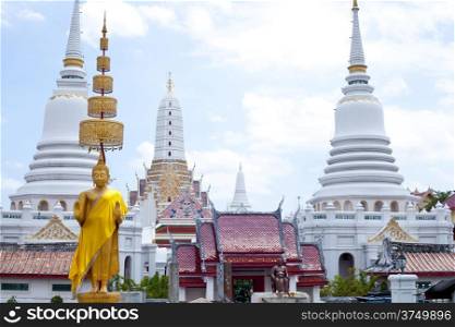Buddhist temples and pagodas and churches and statues. The background is the sky.