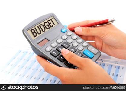Budgeting concept. Hands, pen and calculator.