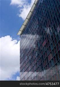 Buerohochhaus-Wolken. facade of a berlin office building with many windows