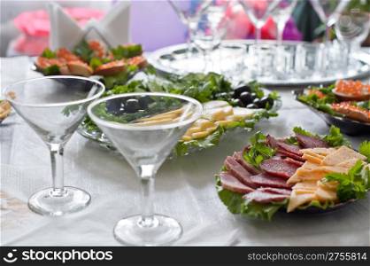Buffet table. A table with glasses and easy snack