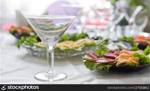 Buffet table. A table with glasses and easy snack