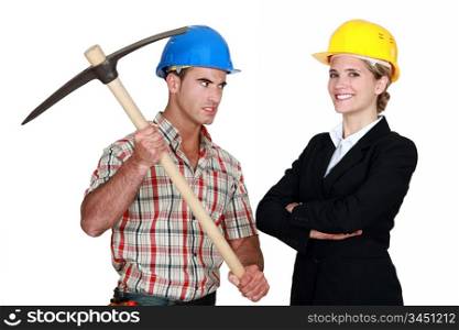 Builder aiming his pickaxe at a smiling architect