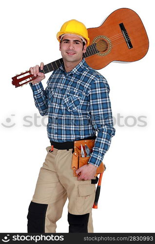 Builder carrying guitar over shoulder