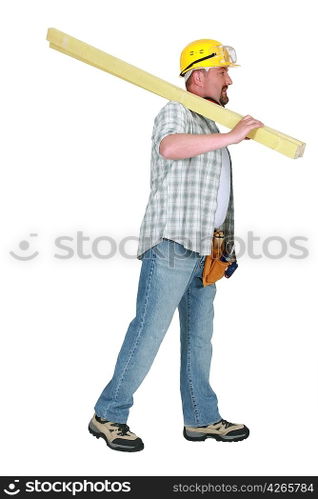 Builder carrying timber