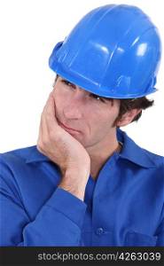 Builder having a good think about what to do next
