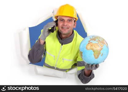 Builder holding globe
