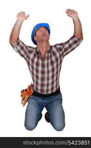 Builder holding up invisible object