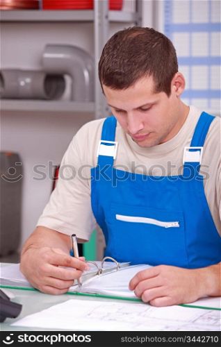Builder looking at paperwork