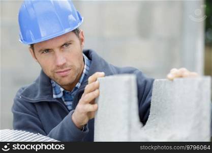 builder man checking concrete block
