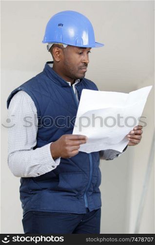 builder reading a map