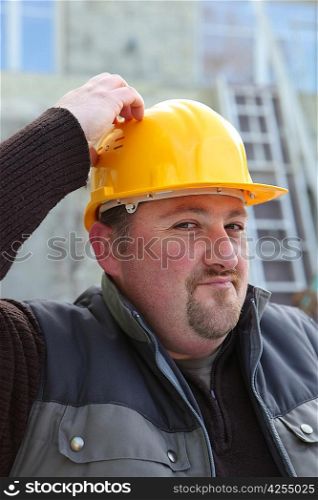 Builder scratching his head