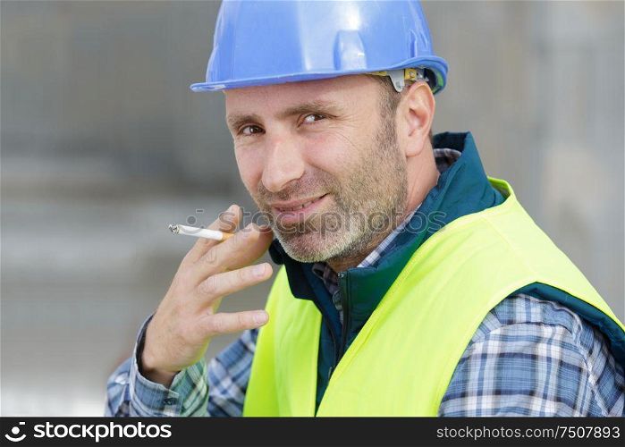 builder smoking in a construction site