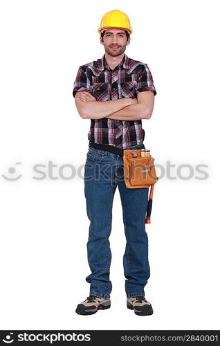 Builder stood with arms crossed