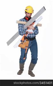 Builder struggling to carry equipment