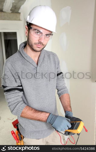 Builder using a voltmeter