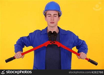 Builder using bolt cutters