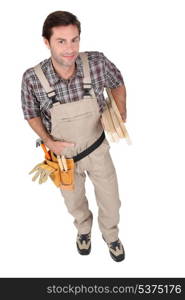Builder wearing tool belt.