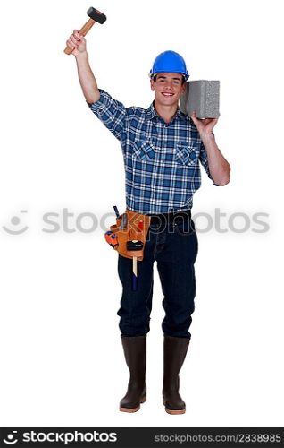 Builder with a block and hammer