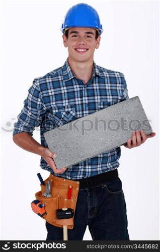 Builder with a concrete block