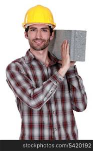 Builder with a concrete block
