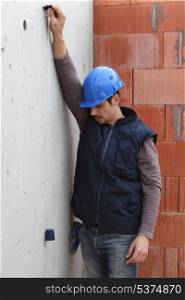 Builder with a plumb line