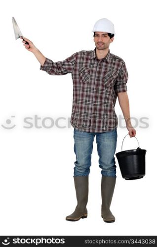 Builder with a trowel and a bucket