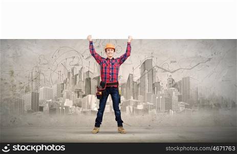 Builder with banner. Young builder man in hardhat holding white blank banner