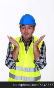 Builder with confused look on face