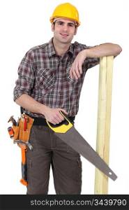 Builder with wood and handsaw