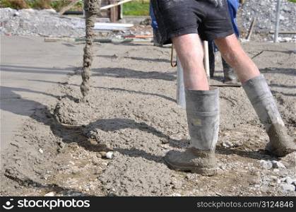 Builders pour concrete slab for a dairy yard