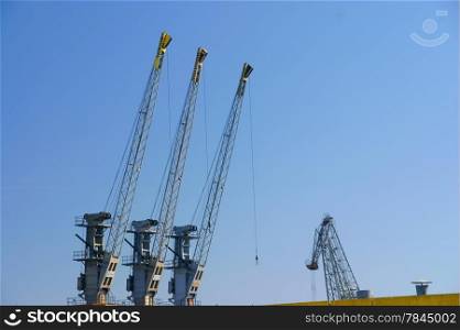 Building activity. Construction site with crane industrial equipment. Exterior.