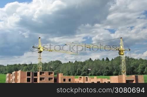 building big living house from scratch, real image on background of cloudy sky near forest, timelapse