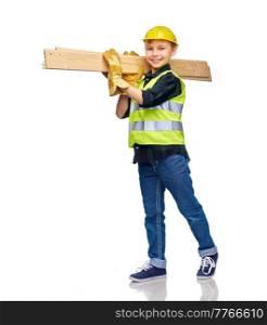 building, carpentry and profession concept - happy smiling little boy in protective helmet, gloves and safety vest with wooden boards over white background. little boy in protective helmet with wooden boards