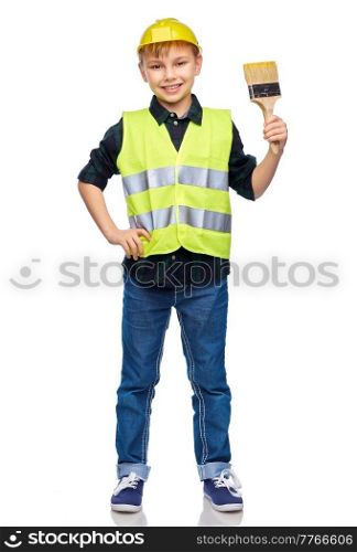 building, construction and profession concept - happy smiling little boy in protective helmet and safety vest with brush over white background. little boy in protective helmet with brush