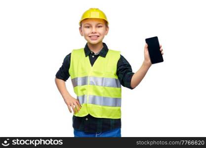 building, construction and profession concept - happy smiling little boy in protective helmet and safety vest with smartphone over white background. little boy in helmet and safety vest with phone