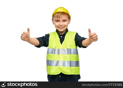 building, construction and profession concept - happy smiling little boy in protective helmet and safety vest showing thumbs up over white background. happy boy in construction helmet showing thumbs up