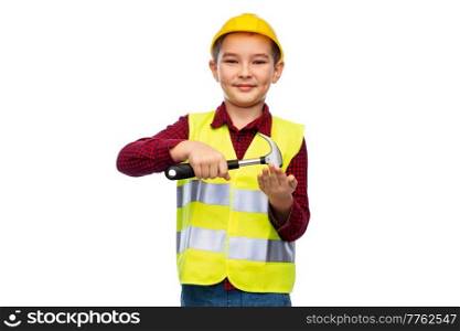 building, construction and profession concept - little boy in protective helmet and safety vest with hammer over white background. boy in protective helmet and vest with hammer