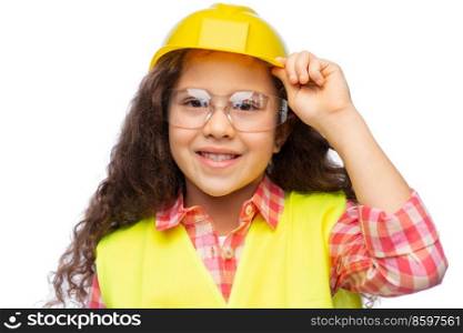 building, construction and profession concept - smiling little girl in goggles, protective helmet and safety vest over white background. little girl in construction helmet and safety vest