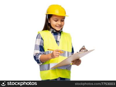 building, construction and profession concept - smiling little girl in protective helmet and safety vest with clipboard and pencil over white background. little girl in construction helmet with clipboard