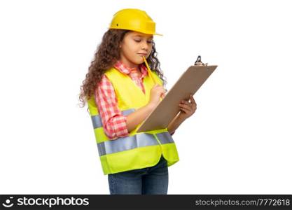building, construction and profession concept - smiling little girl in protective helmet and safety vest with clipboard and pencil over white background. little builder girl with clipboard and pencil