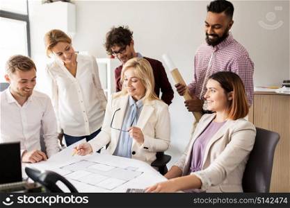 building, construction, architecture, real estate and people concept - business team with blueprint meeting and discussing house project at office. business team discussing house project at office