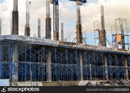 Building construction site against blue sky with blue structure